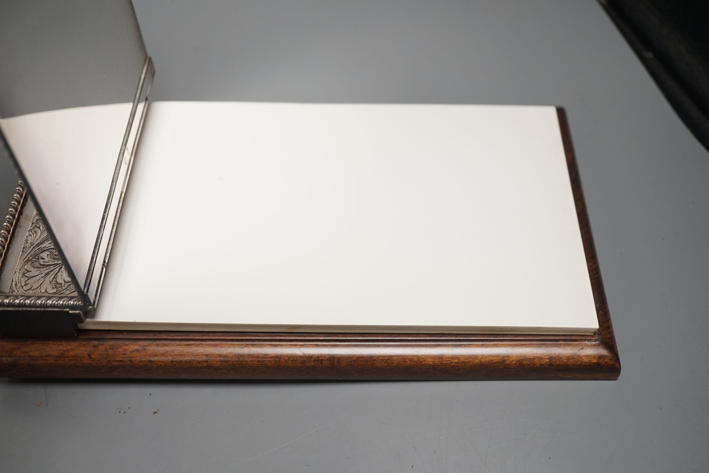A ‘925’ frame and an electroplate mounted desk notepad, 24cm